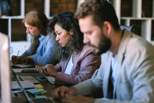 People working in front of computer screens